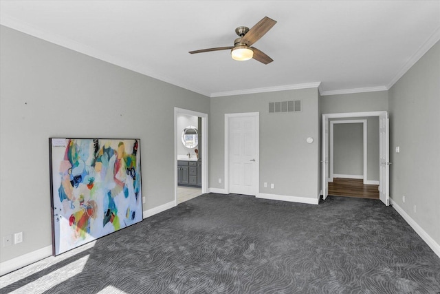 1801 Cobblefield Ct, Champaign, IL 61822 - unfurnished bedroom with crown molding, carpet floors, baseboards, ceiling fan, and connected bathroom