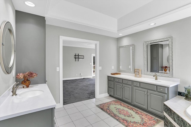 1801 Cobblefield Ct, Champaign, IL 61822 - bathroom with two vanities, tile patterned floors, a relaxing tiled tub, baseboards, and recessed lighting