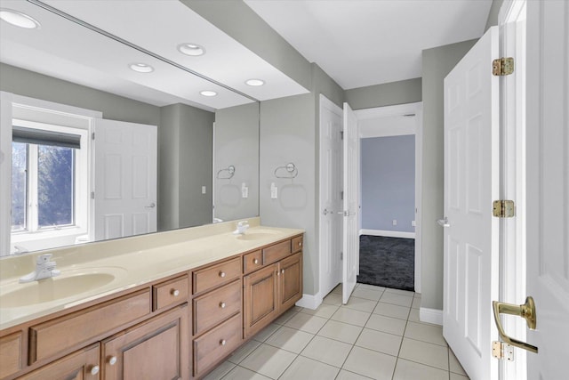 1801 Cobblefield Ct, Champaign, IL 61822 - bathroom with double vanity, tile patterned flooring, recessed lighting, and baseboards
