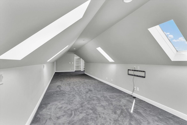 1801 Cobblefield Ct, Champaign, IL 61822 - additional living space with a skylight, carpet, vaulted ceiling, and baseboards