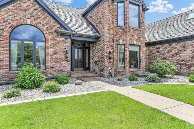 1801 Cobblefield Ct, Champaign, IL 61822 - tudor-style house featuring brick siding and a front yard