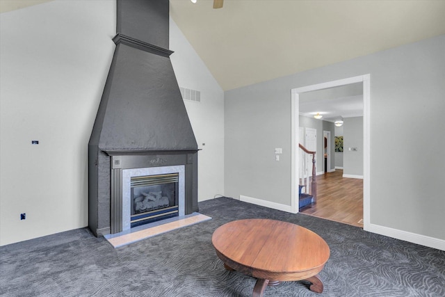 1801 Cobblefield Ct, Champaign, IL 61822 - carpeted living area with a high end fireplace, vaulted ceiling, and baseboards