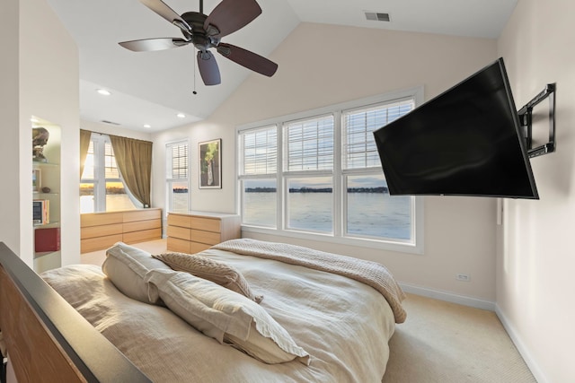 bedroom with vaulted ceiling, light carpet, and ceiling fan