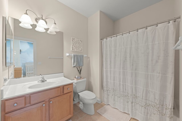 bathroom featuring curtained shower, a chandelier, vanity, toilet, and tile patterned floors