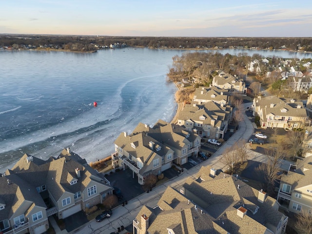 aerial view at dusk with a water view