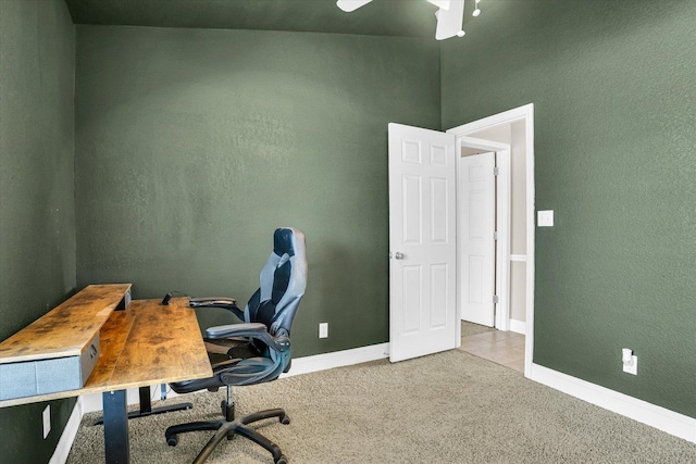 home office with carpet floors and baseboards