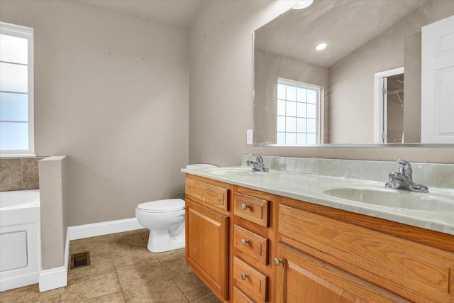 full bath with double vanity, tile patterned flooring, visible vents, and a sink