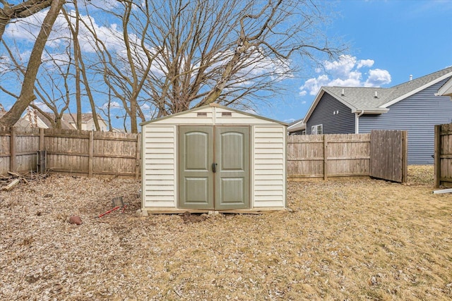 view of shed with a fenced backyard