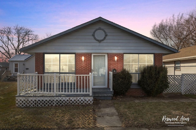 view of front of property with a yard