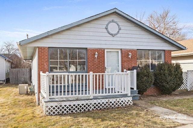 back of property featuring a lawn