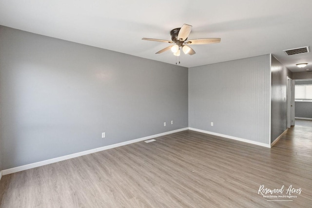 empty room featuring ceiling fan and wood-type flooring