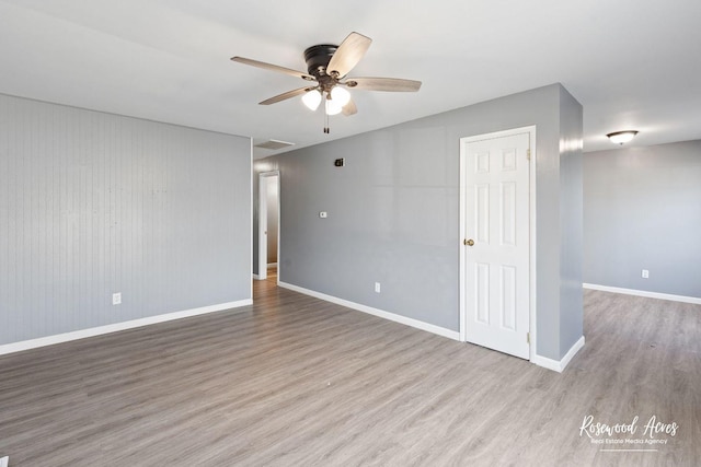 empty room featuring light hardwood / wood-style floors and ceiling fan