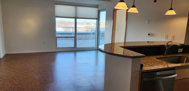 kitchen with sink, stainless steel dishwasher, and kitchen peninsula