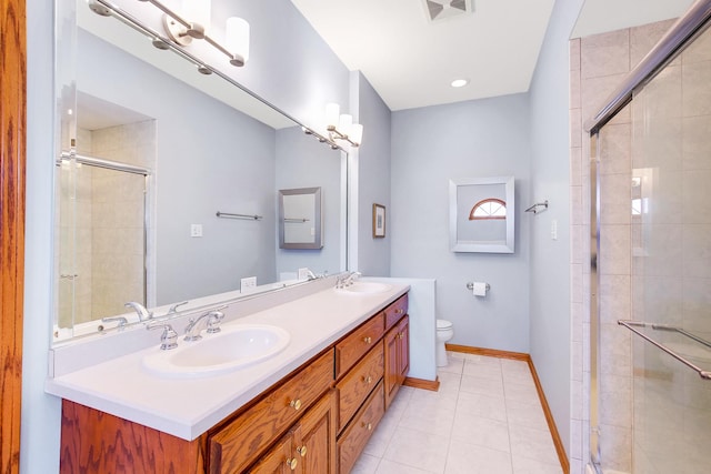 full bathroom featuring a tile shower, double vanity, baseboards, and a sink