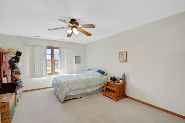 bedroom featuring visible vents, carpet, baseboards, and ceiling fan