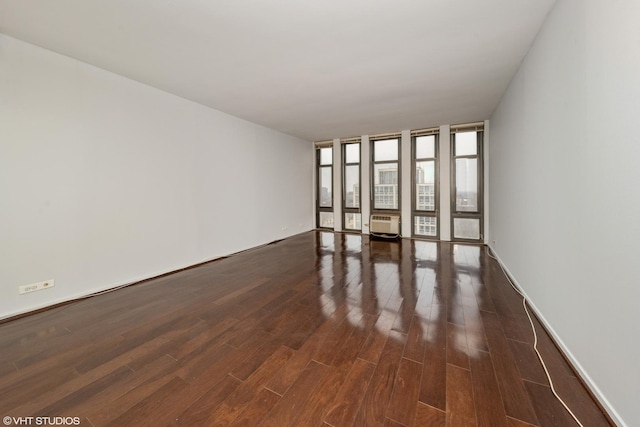 interior space featuring expansive windows and dark hardwood / wood-style floors