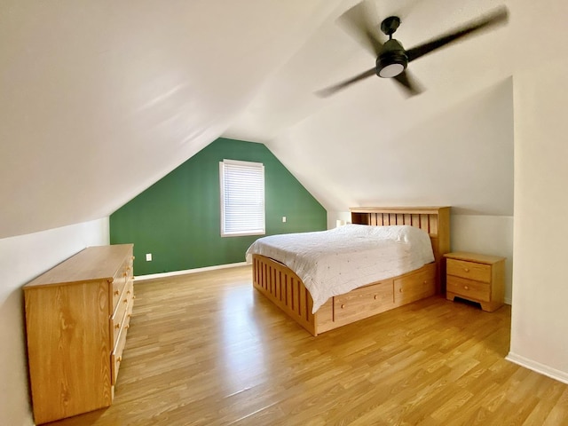 bedroom featuring lofted ceiling, light hardwood / wood-style floors, and ceiling fan