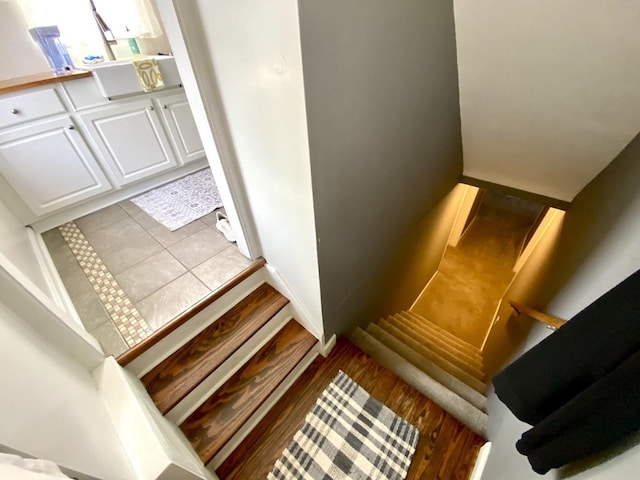 stairway with hardwood / wood-style floors