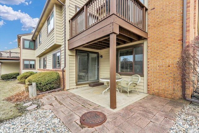 view of patio featuring a balcony