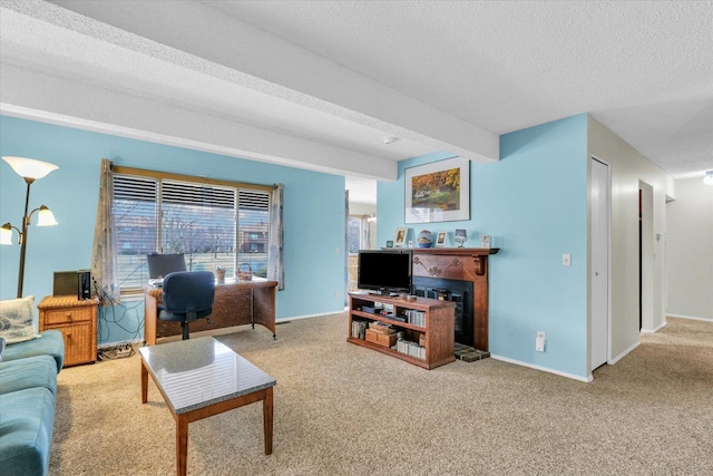 living room with beamed ceiling, carpet floors, and a textured ceiling