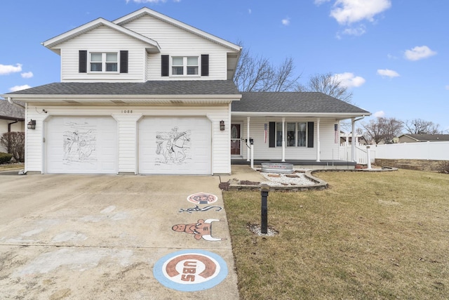 view of front of property featuring a garage, a front yard, and a porch