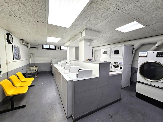 shared laundry area with stacked washer / drying machine and washing machine and clothes dryer