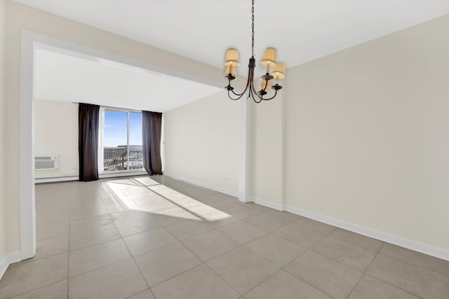 tiled spare room with an inviting chandelier, a wall mounted air conditioner, expansive windows, and a baseboard heating unit