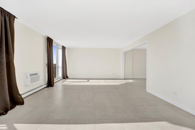 tiled spare room featuring a baseboard radiator and an AC wall unit