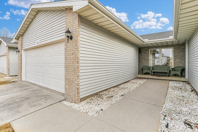 view of side of home featuring a garage