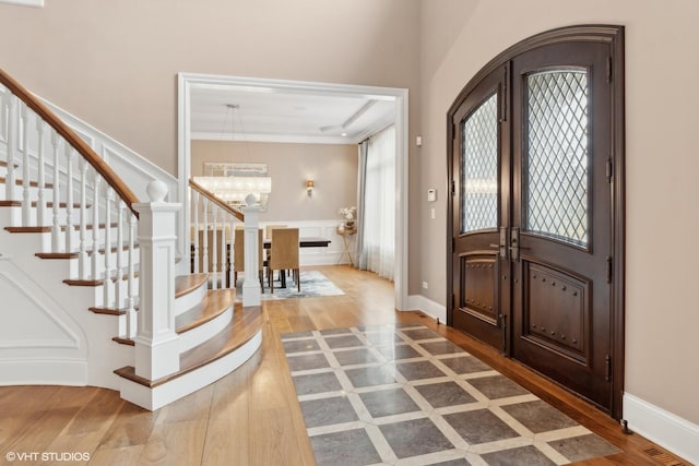6 Ivy Ln, Oak Brook, IL 60523 - entrance foyer featuring stairs, a notable chandelier, a wealth of natural light, and wood finished floors