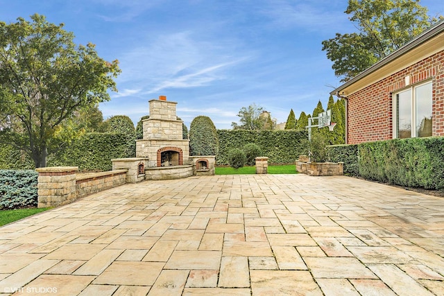 6 Ivy Ln, Oak Brook, IL 60523 - view of patio featuring an outdoor stone fireplace