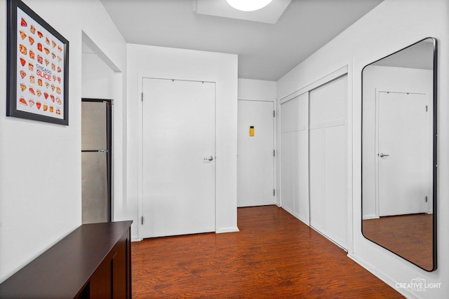 hallway with dark wood-type flooring