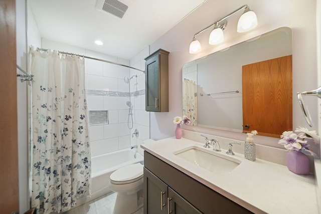 full bathroom featuring shower / tub combo with curtain, vanity, and toilet