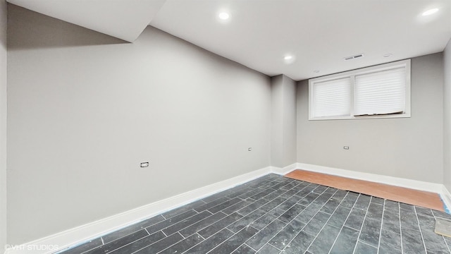 empty room with dark hardwood / wood-style floors