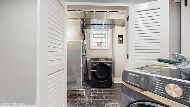 clothes washing area with washer and dryer
