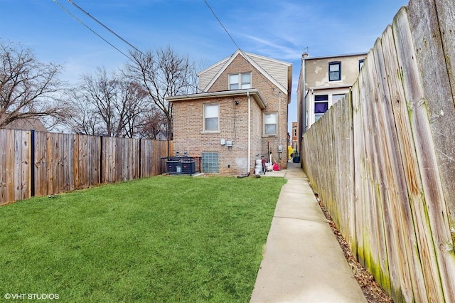 rear view of property with a lawn