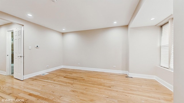 spare room featuring light wood-type flooring