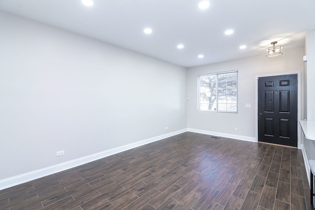 foyer entrance featuring dark hardwood / wood-style flooring