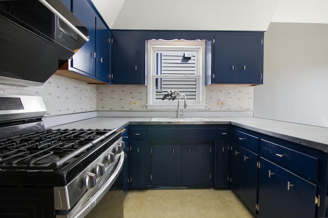 kitchen featuring extractor fan, blue cabinets, sink, backsplash, and gas range