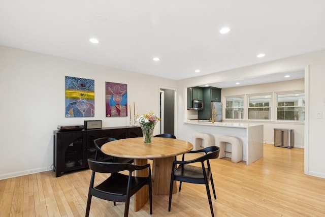 dining room with light wood-type flooring