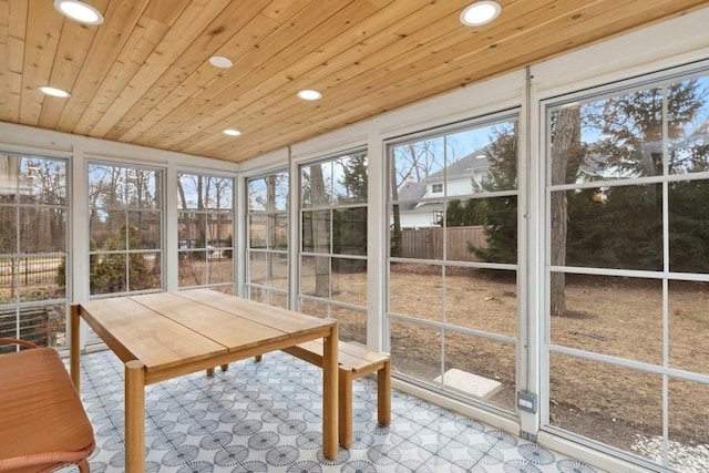 unfurnished sunroom with wood ceiling