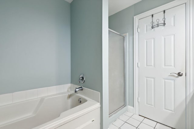 bathroom with plus walk in shower and tile patterned flooring