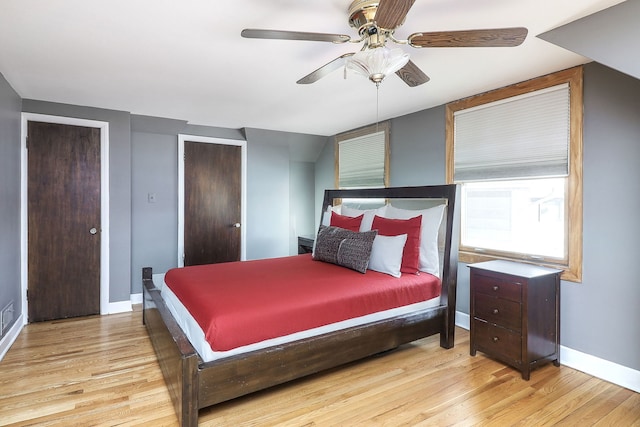 bedroom with ceiling fan and light wood-type flooring