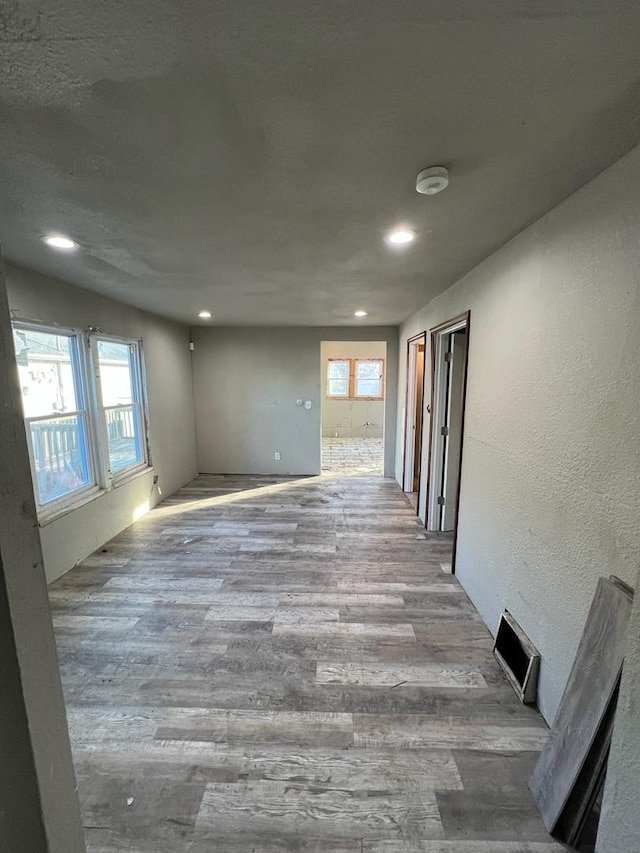 empty room with hardwood / wood-style floors