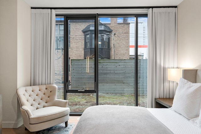 bedroom with hardwood / wood-style floors