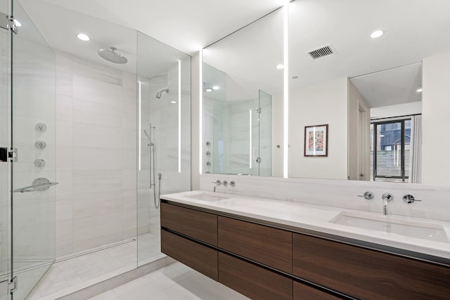 bathroom featuring vanity and an enclosed shower