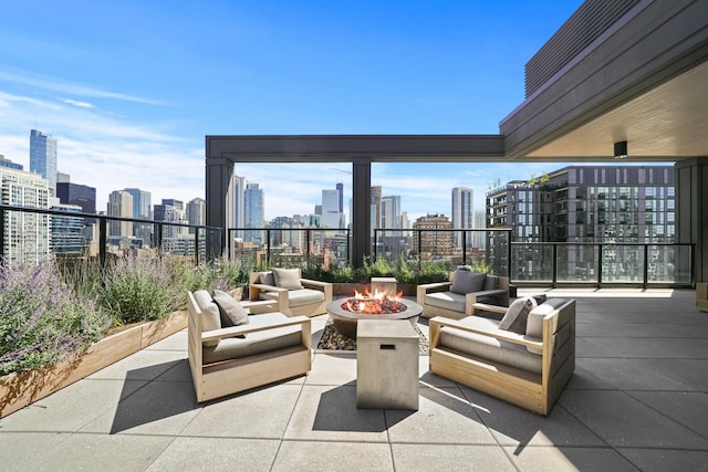 view of patio / terrace featuring an outdoor living space with a fire pit