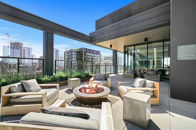 view of patio / terrace with an outdoor living space with a fire pit