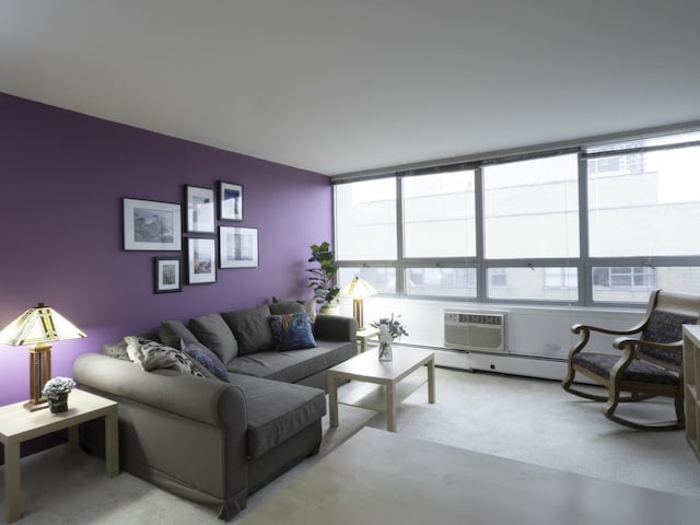 carpeted living room with a wall mounted AC