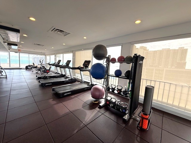 exercise room featuring recessed lighting and visible vents